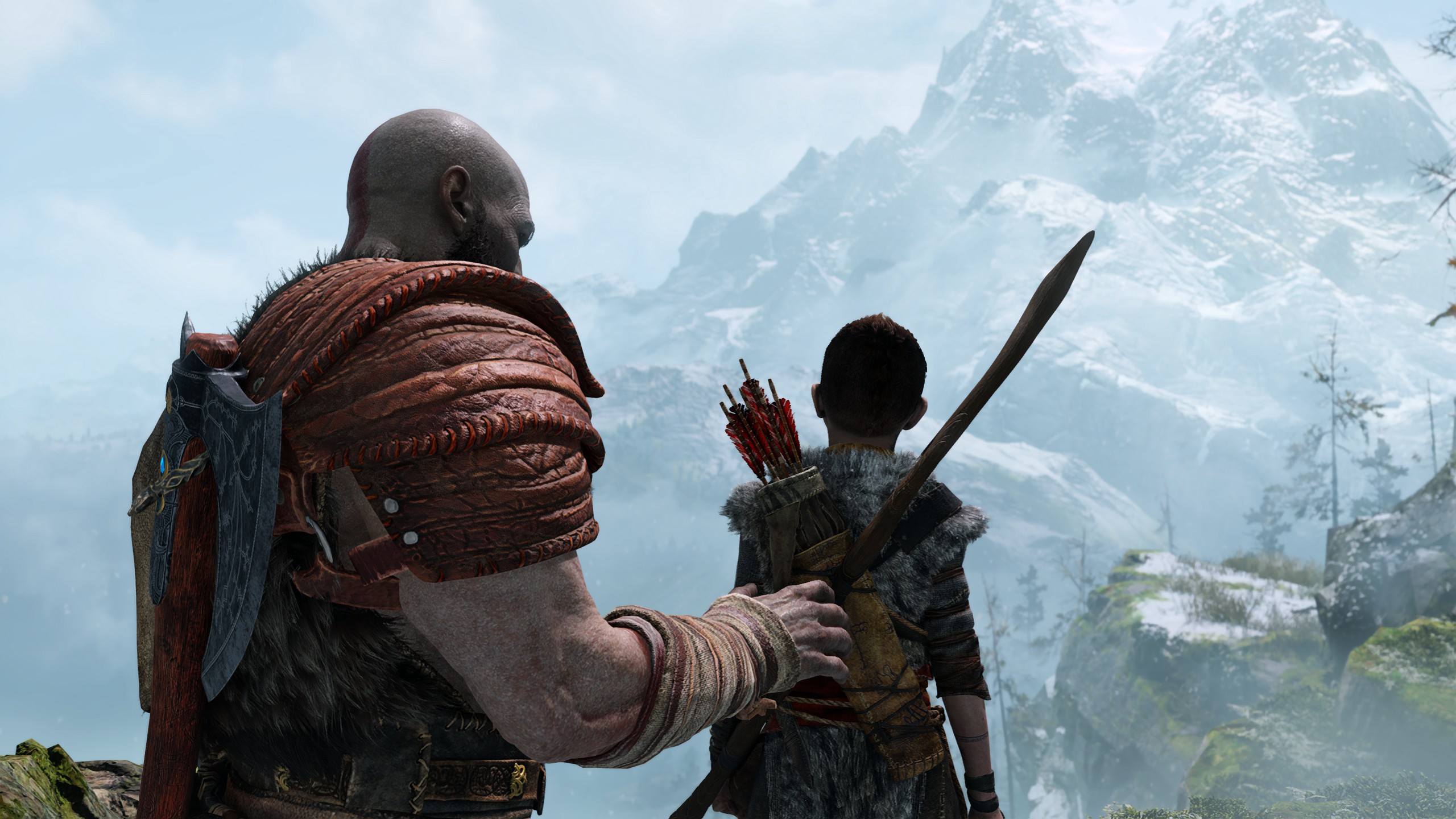 Kratos hesitates to comfort his son Atreus.