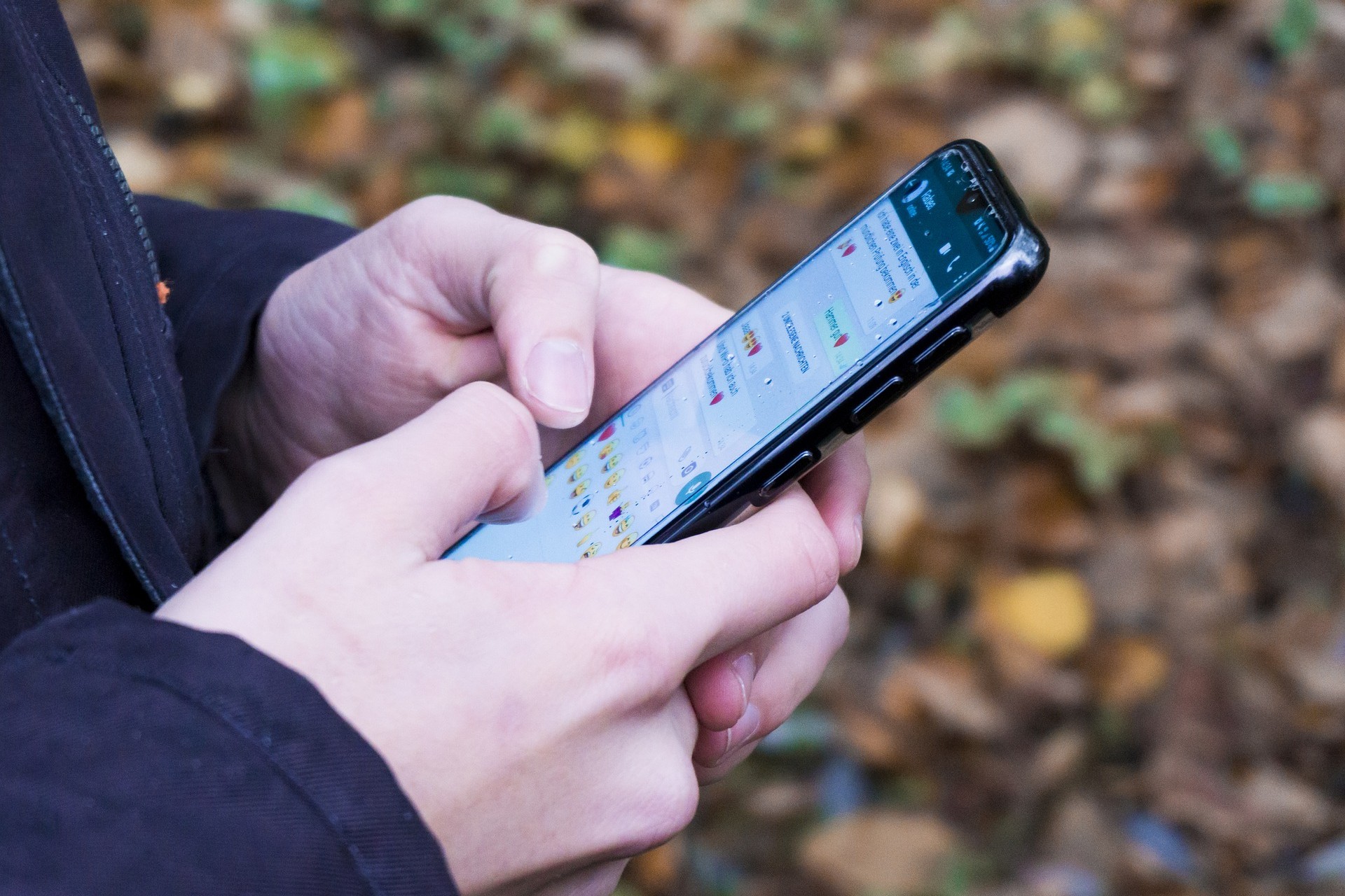 A person using WhatsApp Messenger on his Android smartphone.