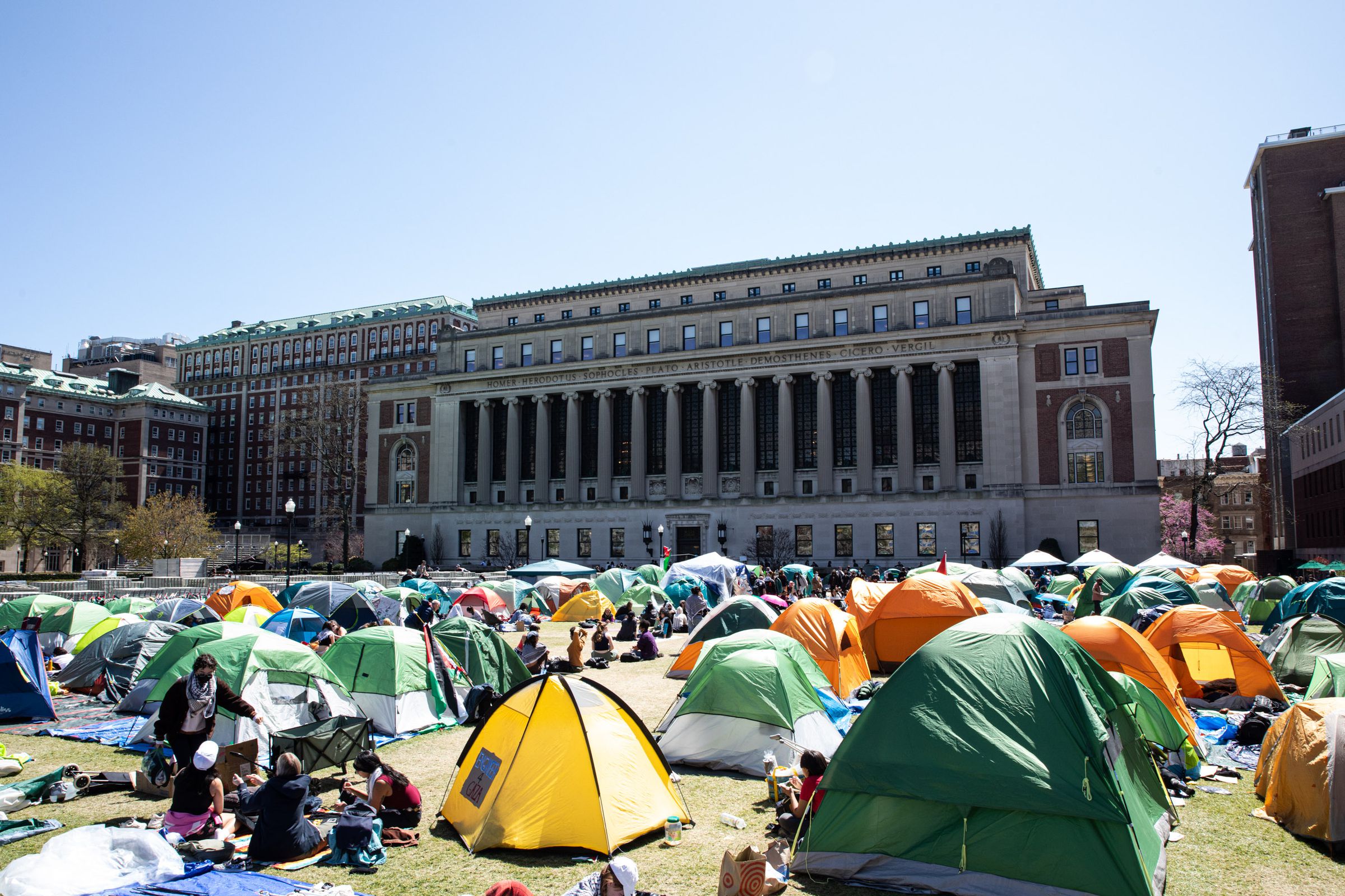 Students lounge in their tents, do homework, and hang out.