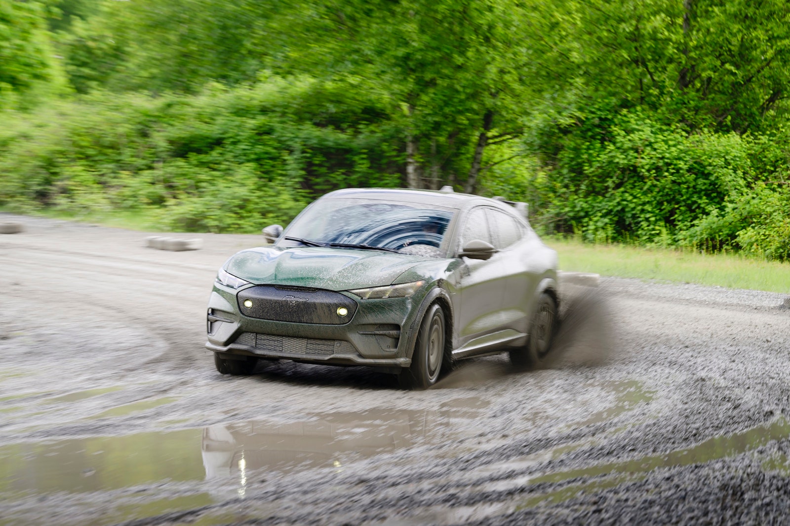 Ford MachE Rally⁤ racing on a ​dirt road