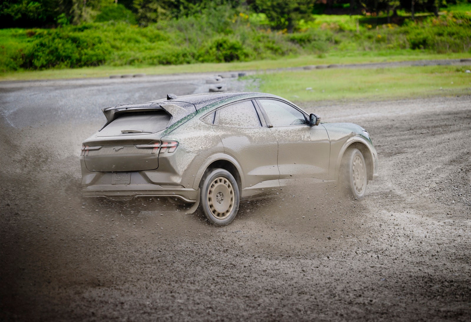 Ford MachE Rally racing⁤ on a dirt road